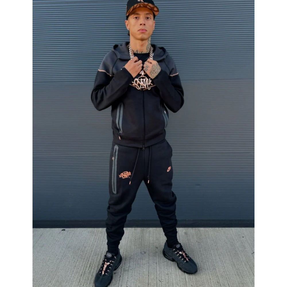 
                  
                    Nike Tech Fleece Tracksuit x Syna World x Central Cee (Black Rose Gold)
                  
                